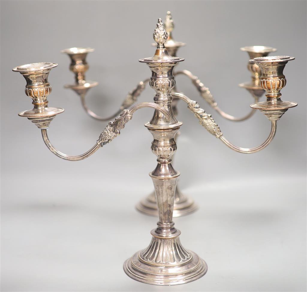 A pair of plated two branch candelabra, height 34cm